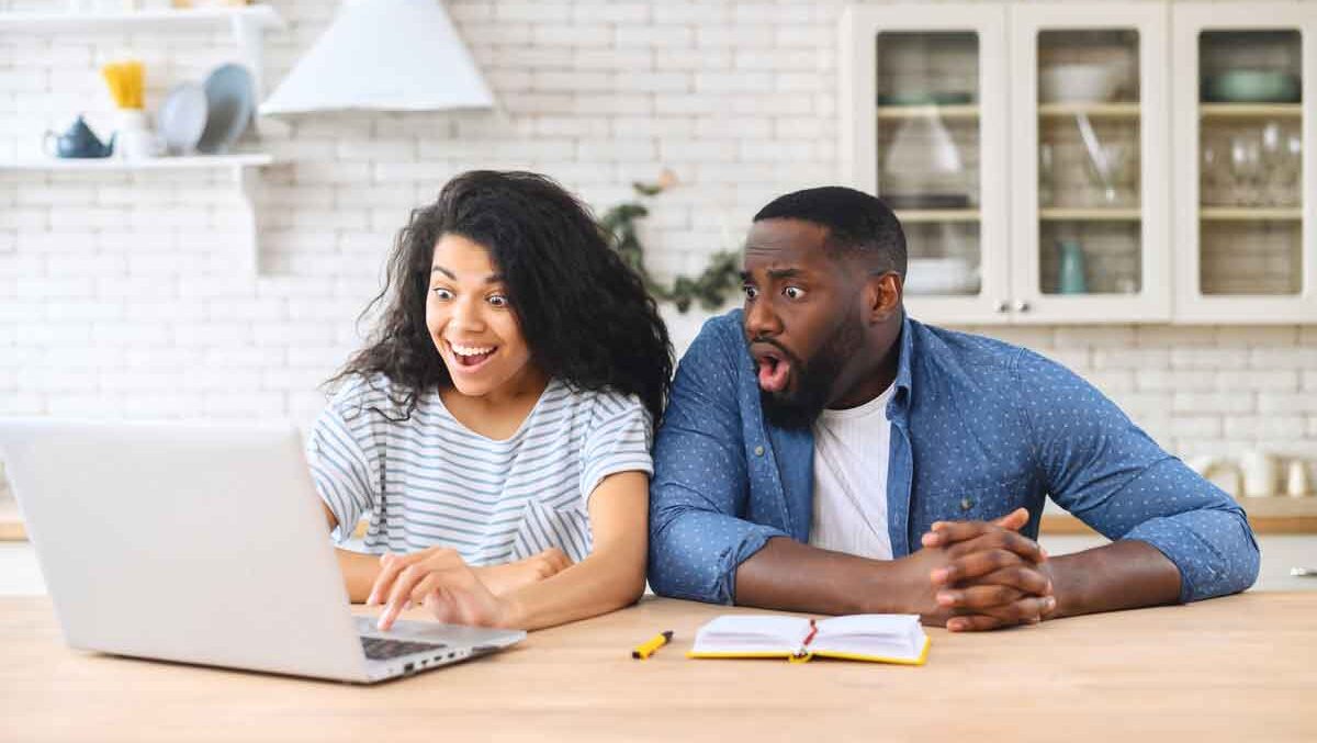 Happy couple on a laptop